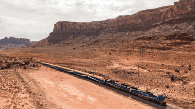 Canyon Spirit train moving through the American Southwest landscape